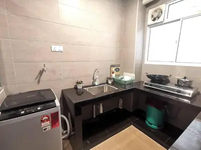 a small kitchen with a sink and a stove at MhPlatinum Gombak ShareHouse Room in Kuala Lumpur