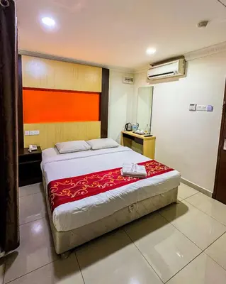 a bedroom with a large bed in a room at THE STARION HOTEL BUKIT BINTANG in Kuala Lumpur