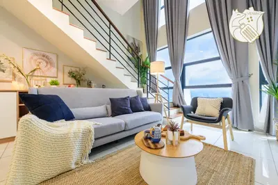 a living room with a couch and a table at Zen-Inspired Duplex Luxury 6Pax, Arte Mont Kiara by Verano in Kuala Lumpur