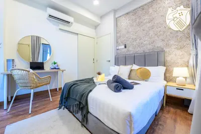 a bedroom with a bed and a chair and a mirror at Zen-Inspired Duplex Luxury 6Pax, Arte Mont Kiara by Verano in Kuala Lumpur