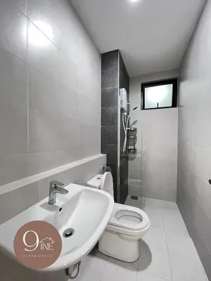 a white bathroom with a toilet and a sink at TF009 - Lavile Sunway Velocity KL View in Kuala Lumpur