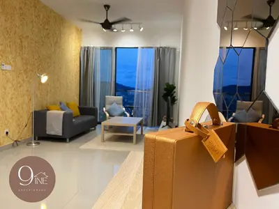 a living room with a suitcase in front of a living room at TF009 - Lavile Sunway Velocity KL View in Kuala Lumpur