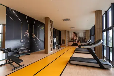 a gym with treadmills and a treadmill at Lovely 3-bedroom w pool 7 pax - Jalan Cheras in Kuala Lumpur