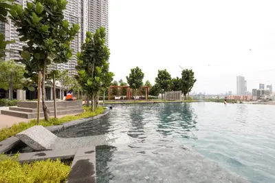 a swimming pool in the middle of a city at Lovely 3-bedroom w pool 7 pax - Jalan Cheras in Kuala Lumpur