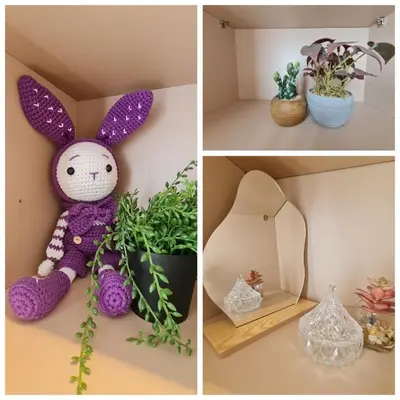 a purple stuffed bunny sitting on a shelf with plants at Cozy Modern Tiny Home 2R1B 10 mins to KLCC in Kuala Lumpur