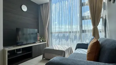 a living room with a tv and a large window at Panoramic KL View @Robertson Bukit Bintang 40f in Kuala Lumpur