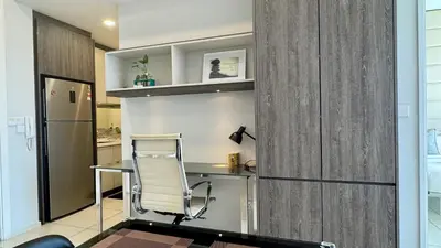 an office with a chair and a desk in a room at Panoramic KL View @Robertson Bukit Bintang 40f in Kuala Lumpur
