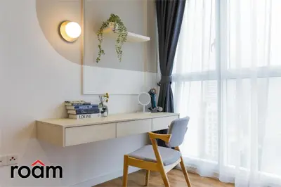 a desk and a chair in a room with a window at Quill Residences KLCC, Five Senses in Kuala Lumpur