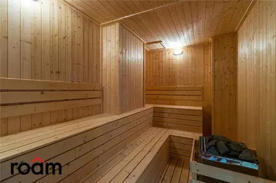 a sauna with wooden paneled walls and ceilings at Quill Residences KLCC, Five Senses in Kuala Lumpur
