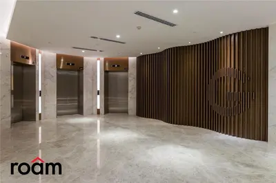 a lobby with a room with a sign on the wall at Quill Residences KLCC, Five Senses in Kuala Lumpur