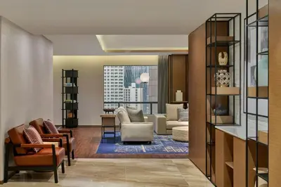 a living room with a view of a living room at Four Points by Sheraton Kuala Lumpur, City Centre in Kuala Lumpur