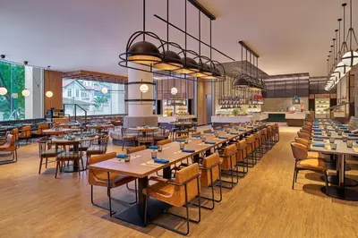 a restaurant with tables and chairs in a room at Four Points by Sheraton Kuala Lumpur, City Centre in Kuala Lumpur
