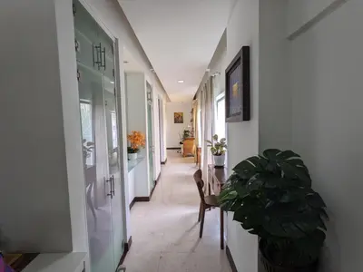 a hallway with a table and a dining room at Damansara Studio in Kuala Lumpur