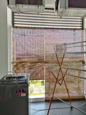 a window with a gate and a trash can next to it at SETAPAK CENTRAL KL - Lavender Zetapark Suite in Kuala Lumpur