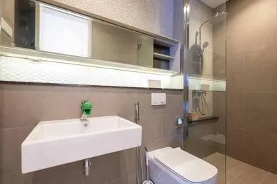 a bathroom with a sink and a toilet and a mirror at Cute Dinosaur Kids Theme@Lucentia LalaPort BBCC in Kuala Lumpur