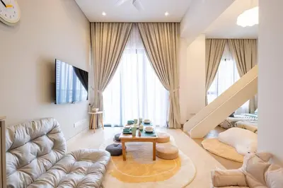 a living room with a couch and a table at Cute Dinosaur Kids Theme@Lucentia LalaPort BBCC in Kuala Lumpur