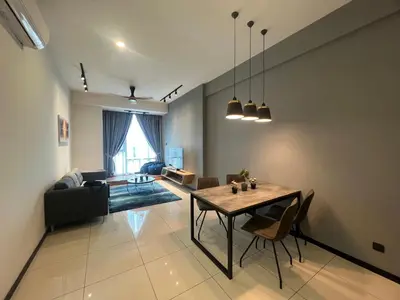 a living room with a table and a couch at Opus Residences 2 Bedroom Apartment in Kuala Lumpur
