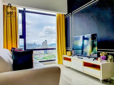 a living room with a tv and a large window at 1 min to Pavilion KL Heart of Bukit Bintang by GBS in Kuala Lumpur