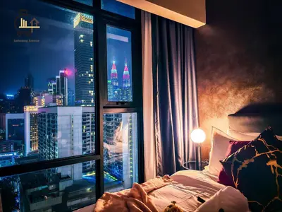 a bedroom with a view of a city from a window at 1 min to Pavilion KL Heart of Bukit Bintang by GBS in Kuala Lumpur