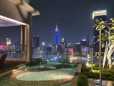 a view of a city skyline at night at 1 min to Pavilion KL Heart of Bukit Bintang by GBS in Kuala Lumpur