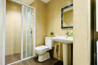 a bathroom with a toilet and a sink and a shower at Comfy-Concept Apartment @ B.Bintang (3min walk LRT, Lalaport, TimeSquare) in Kuala Lumpur