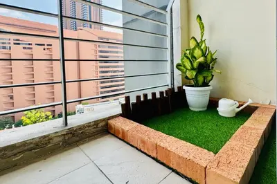 a room with a window with a plant and grass at Comfy-Concept Apartment @ B.Bintang (3min walk LRT, Lalaport, TimeSquare) in Kuala Lumpur