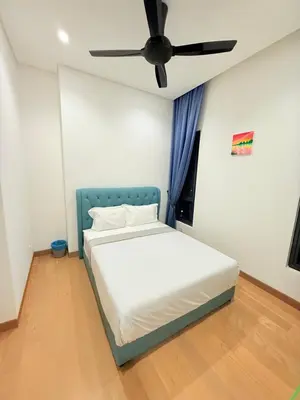 a bed in a room with a ceiling fan at BBCC APARTMENT AT LUCENTIA 2 in Kuala Lumpur