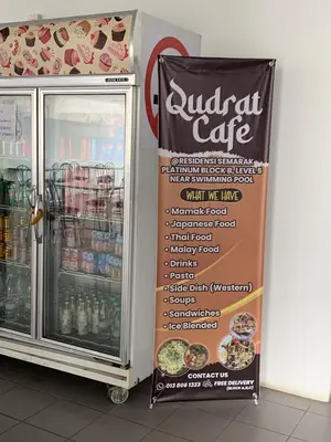 a nutrition cafe sign in front of a refrigerator at Irizz Inn @Homestay Platinum Splendor in Kuala Lumpur