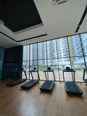 a gym with a row of treadmills in a room at Irizz Inn @Homestay Platinum Splendor in Kuala Lumpur