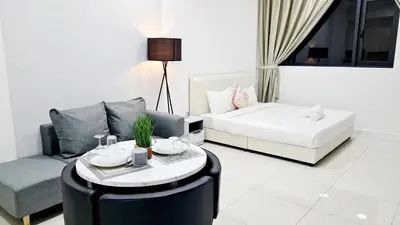 a living room with a couch and a coffee table at Kualalampur Chambers KLCC By Sky Pool in Kuala Lumpur