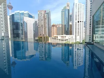 a view of a city from a swimming pool at RM203A Bukit Bintang Balcony Studio Infinity Pool in Kuala Lumpur