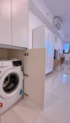 a kitchen with a washing machine in a room at Cozy & Homely Chambers KL@3 Mins Walking Distance to LRT & Monorail in Kuala Lumpur