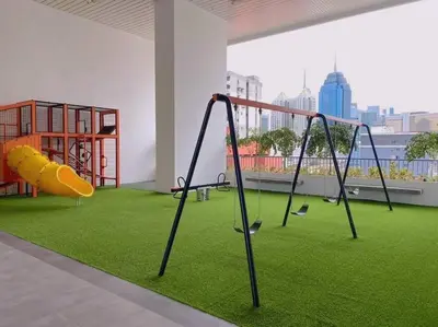 a play area with a playground with a slide at Cozy & Homely Chambers KL@3 Mins Walking Distance to LRT & Monorail in Kuala Lumpur
