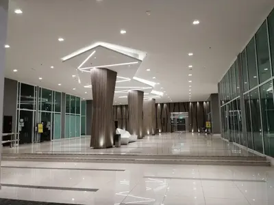 a lobby of a building with columns and windows at Infinity pool! High Speed WiFi! Rica Residence! in Kuala Lumpur