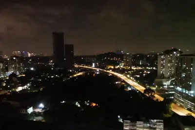 a city lit up at night with a freeway at Infinity pool! High Speed WiFi! Rica Residence! in Kuala Lumpur