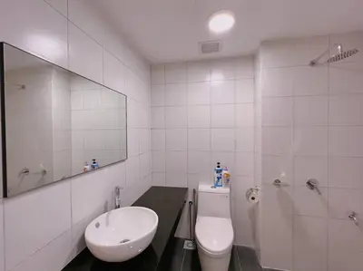 a bathroom with a toilet and a sink and a mirror at Comfy & Cozy Chambers KL, Near PWTC & Sunway Putra Mall in Kuala Lumpur