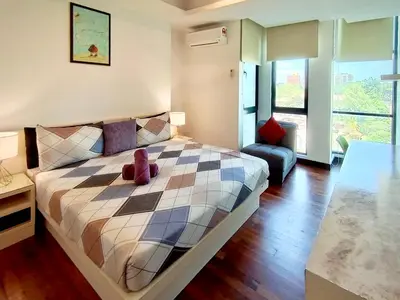 a bedroom with a bed with a teddy bear on it at BBHomes at Bukit Bintang Casa Residency KL in Kuala Lumpur