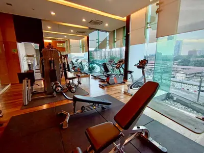 a gym with several exercise equipment in a building at BBHomes at Bukit Bintang Casa Residency KL in Kuala Lumpur