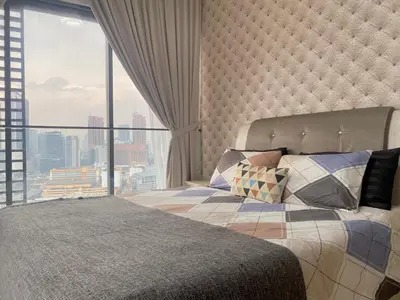 a bedroom with a bed and a large window at BBHomes at Continew Residensi Pudu KL digitalife in Kuala Lumpur