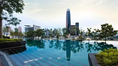 a swimming pool with a city skyline in the background at BBHomes at Continew Residensi Pudu KL digitalife in Kuala Lumpur