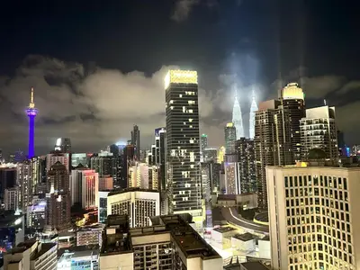 a view of a city skyline at night at Axon Suites Bukit Bintang by Prestige in Kuala Lumpur