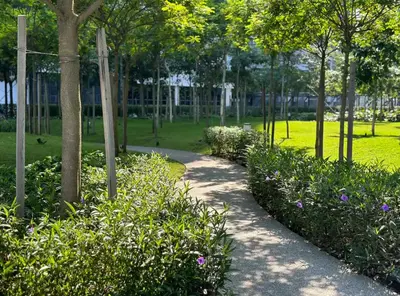 a path in a park with flowers and trees at MVD15#Family Suite 8pax 3 Rooms Sunway Velocity Mall Cheras IKEA Mytown Short Walk to MRT & LRT Maluri in Kuala Lumpur