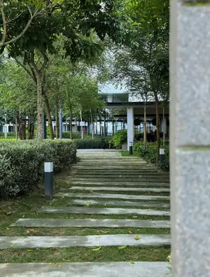 a stone walkway with trees and a building at MVD15#Family Suite 8pax 3 Rooms Sunway Velocity Mall Cheras IKEA Mytown Short Walk to MRT & LRT Maluri in Kuala Lumpur