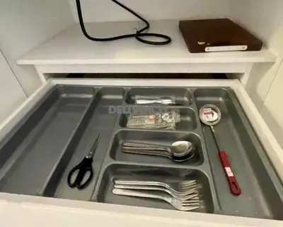 a drawer in a refrigerator filled with utensils at Continew at 35 floor - 5pax - KL - TRX - 2 Bedroom in Kuala Lumpur