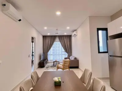 a dining room with a table and a living room at Ample 2BR 4px Seputeh @ Near MidValley & Garden Mall, Old Klang Road in Kuala Lumpur