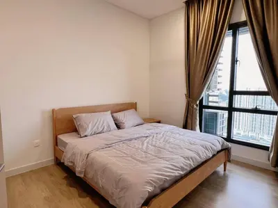 a bed in a bedroom with a large window at Ample 2BR 4px Seputeh @ Near MidValley & Garden Mall, Old Klang Road in Kuala Lumpur