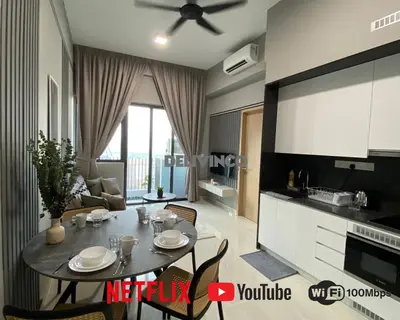 a living room with a table and a kitchen at The Luxe - 3 pax - KLCC View - Balcony at 27 floor in Kuala Lumpur