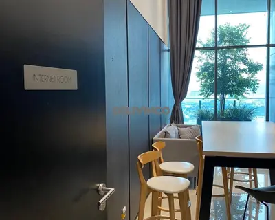 a dining room with a table and chairs and a window at The Luxe - 3 pax - KLCC View - Balcony at 27 floor in Kuala Lumpur