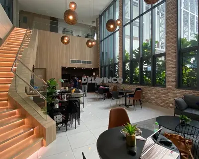 a restaurant with a staircase and tables and chairs at The Luxe 2 pax Studio at KL - Microwave - Washer in Kuala Lumpur