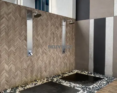 a bathroom with a shower with a mosaic floor at Stylish AeroSpace Theme 1BR in KL City Center in Kuala Lumpur